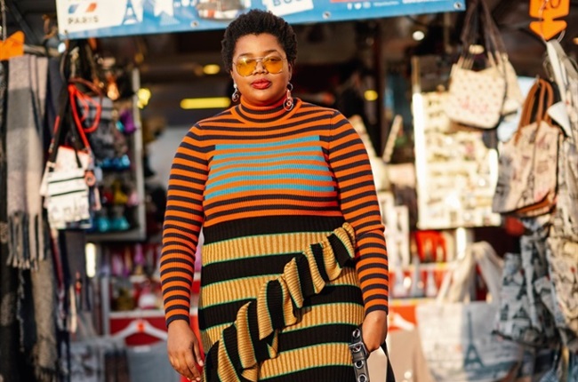 Gabriella Karefa-Johnson in a ruffle hemmed turtleneck Kenzo dress outside Rochas, during Paris Fashion Week Womenswear Fall/Winter 2019/2020, on February 27, 2019 in Paris, France. (Photo by Edward Berthelot/Getty Images)