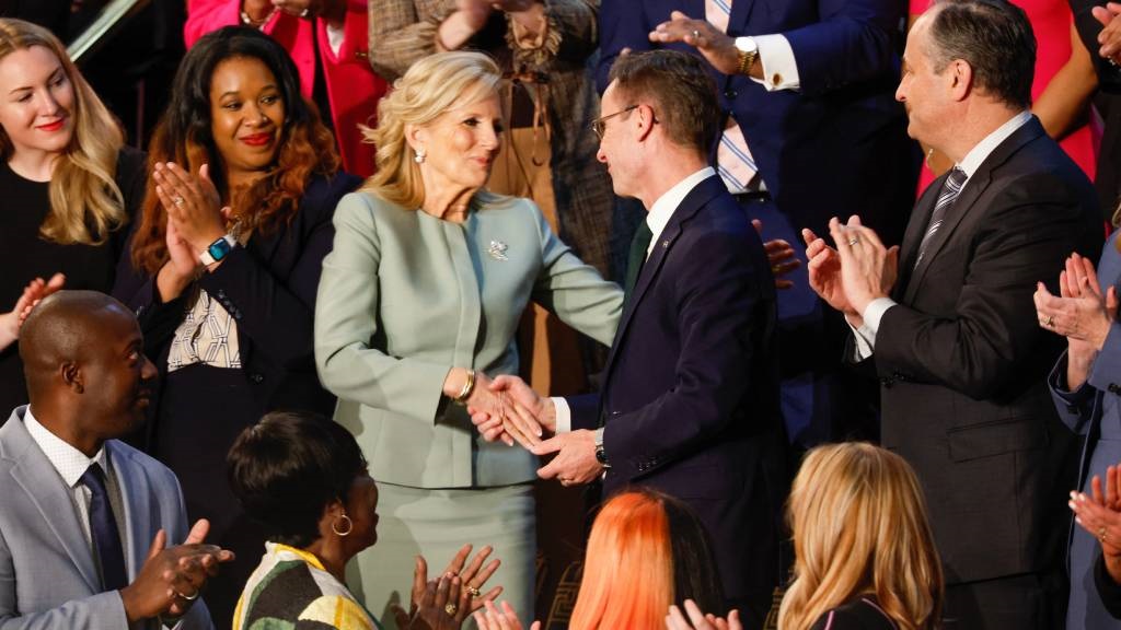 First Lady Jill Biden shakes hands with Prime Mini