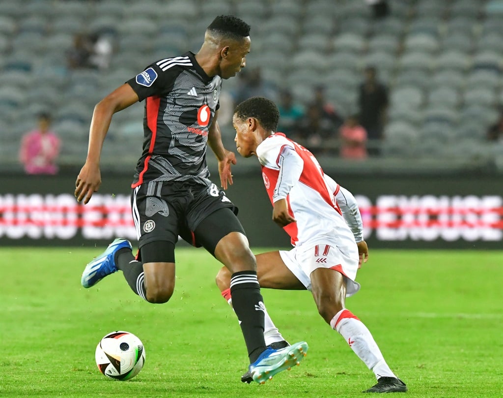 JOHANNESBURG, SOUTH AFRICA - MARCH 06:  Asanele Velebayi of Cape Town Spur with possession challenged by Mbatha Thalente of Orlando Pirates during the DStv Premiership match between Orlando Pirates and Cape Town Spurs at Orlando Stadium on March 06, 2024 in Johannesburg, South Africa. (Photo by Sydney Seshibedi/Gallo Images)