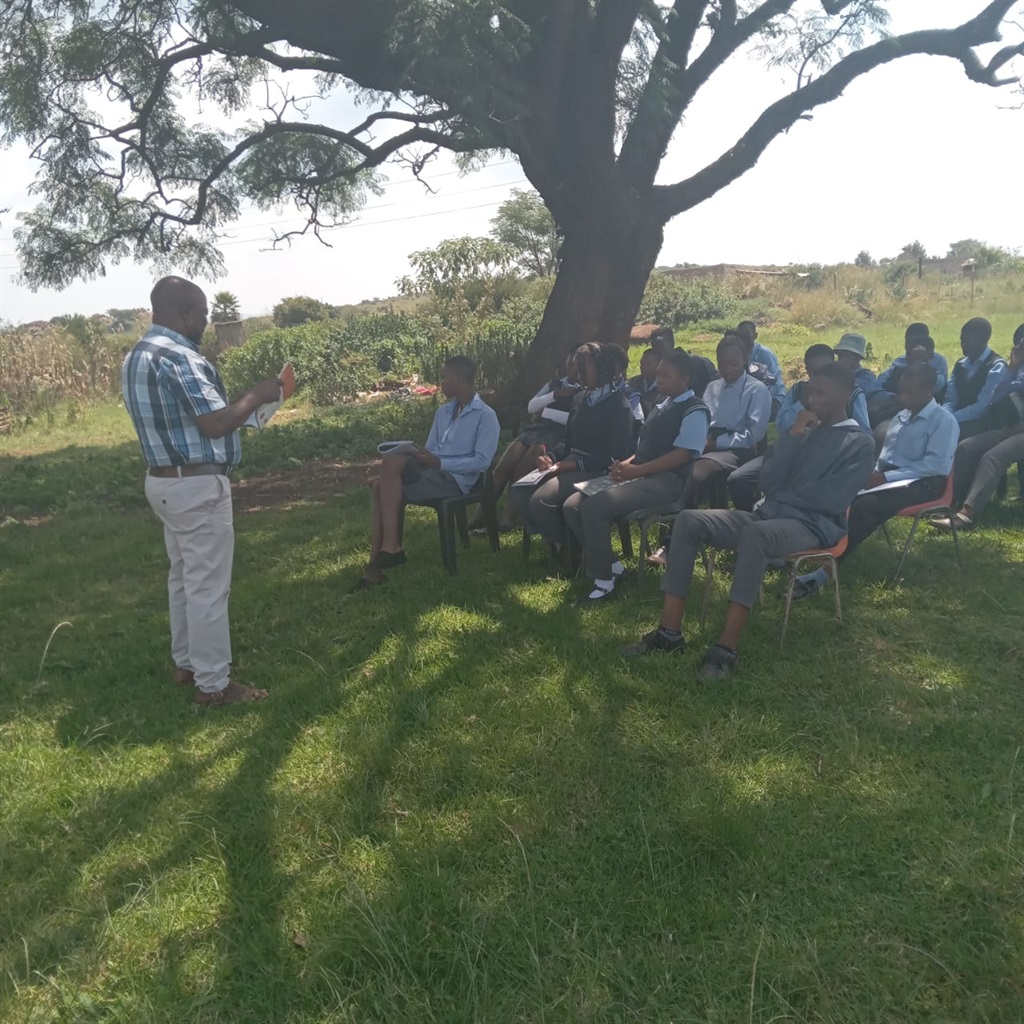 Pupils at Sango Combined School are taught under the tree.