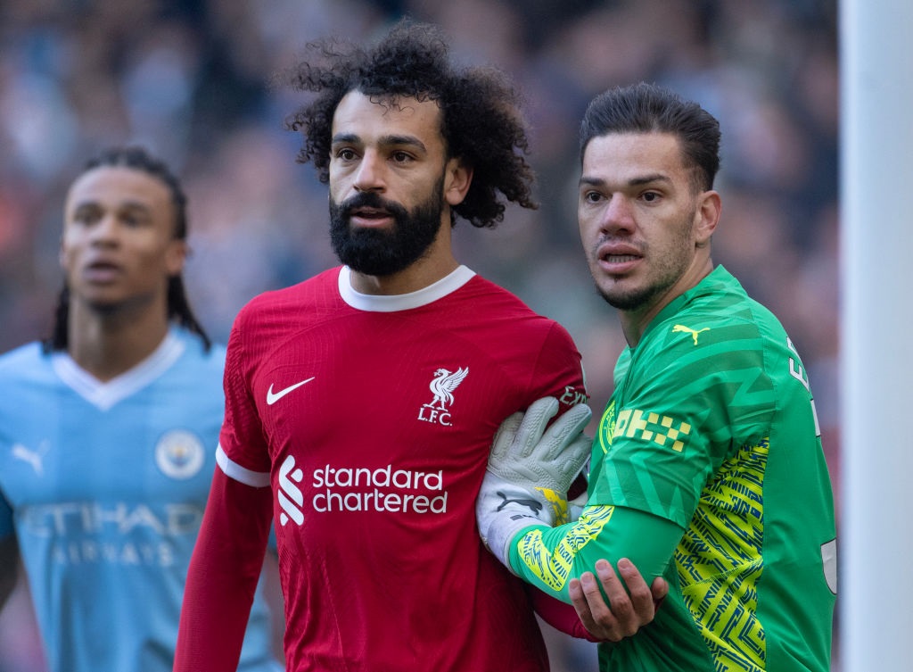 MANCHESTER, ENGLAND - NOVEMBER 25: Mohamed Salah of Liverpool and Manchester City goalkeeper Ederson during the Premier League match between Manchester City and Liverpool FC at Etihad Stadium on November 25, 2023 in Manchester, England. (Photo by Visionhaus/Getty Images)