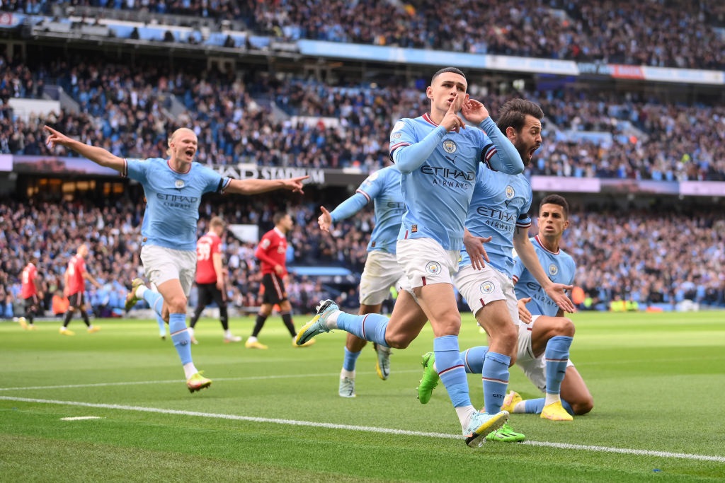 MANCHESTER, ENGLAND - OCTOBER 02: Phil Foden of Manchester City celebrates their sides first goal during the Premier League match between Manchester City and Manchester United at Etihad Stadium on October 02, 2022 in Manchester, England. (Photo by Laurence Griffiths/Getty Images)