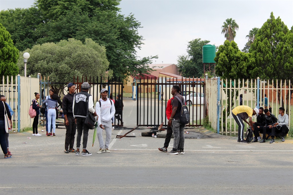 Students outside one of the main gates at the Tshwane University of Technology. 