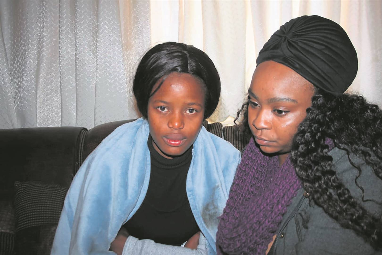 GRIEVING: Atlegang’s girlfriend Nqobile Mdlalose and his older sister, Lethabo Mohlala, mourn his death. Atlegang Selepe (inset) was shot dead.          Photo by                      Phineas Khoza