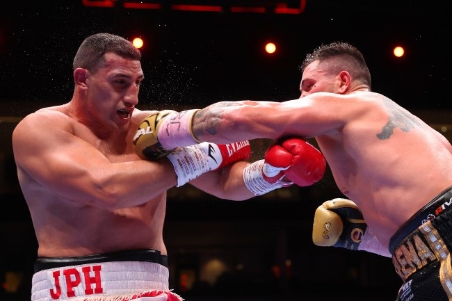 Kevin Lerena punches Justis Huni during the WBO Global Heavyweight Title fight between Justis Huni and Kevin Lerena on the Knockout Chaos boxing card at the Kingdom Arena on March 08, 2024 in Riyadh, Saudi Arabia. (Richard Pelham/Getty Images)