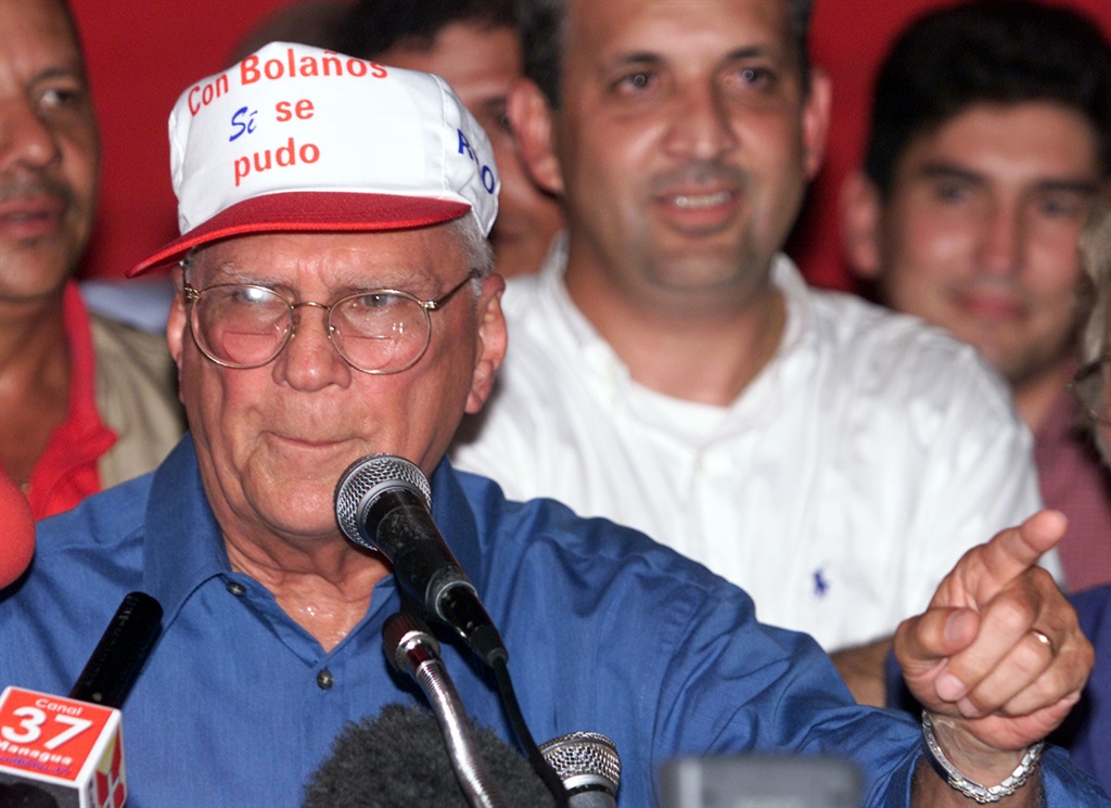 Former Nicaraguan president Enrique Bolanos greets the crowd November 5, 2001 at Liberal Party headquarters in Managua, Nicaragau.  (Photo by Max Trujillo/Getty Images)