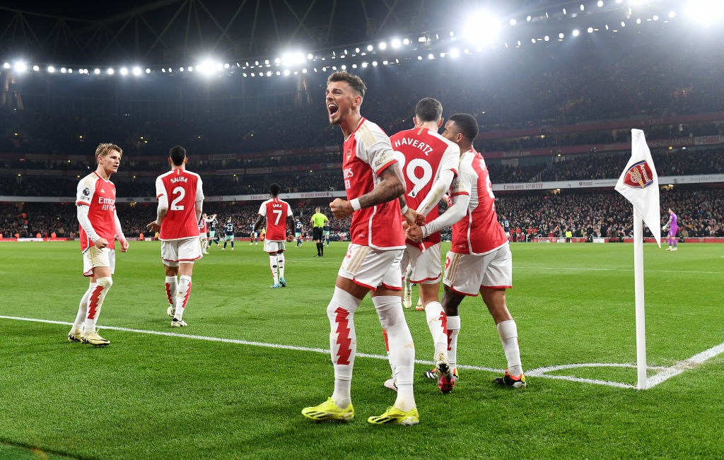 LONDON, ENGLAND - MARCH 09: Ben White of Arsenal celebrates after teammate Kai Havertz scores his teams second goal during the Premier League match between Arsenal FC and Brentford FC at Emirates Stadium on March 09, 2024 in London, England. (Photo by David Price/Arsenal FC via Getty Images)