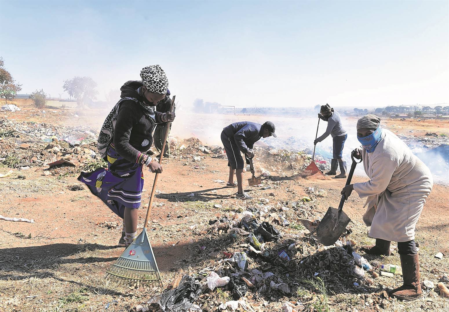 Dobsonville residents in Soweto cleaned an illegal dumping area to make space for a hawkers’ market.    Photo by Morapedi Mashashe