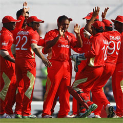 Canada celebrate the early wicket of Brendan Taylor. (AFP)