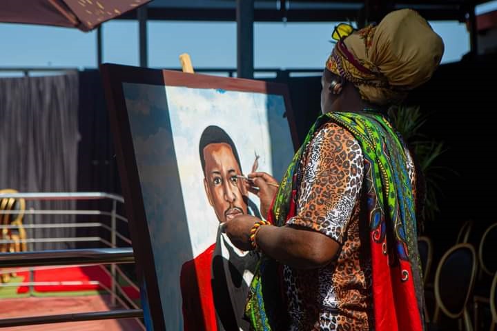 Artist Lebani 'Rasta' Sirejenje painting a portrait of Sibonelo Mhlongo, who was played by Wiseman Mncube on Uzalo. 