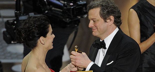Colin Firth accepts the Best Actor Oscar from Sandra Bullock at the 83rd annual Academy Awards in Hollywood. (AP Photo/Mark J. Terrill)