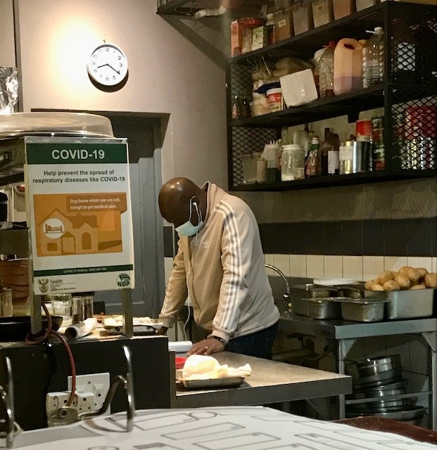 This restaurant manager’s body language says it all. This photo was taken at the Fat Cactus in Gardens, Cape Town, while watching President Ramaphosa’s address to the nation on Sunday night, when he announced that restaurants may now only serve takeaways. Photo: Kaylee Bush