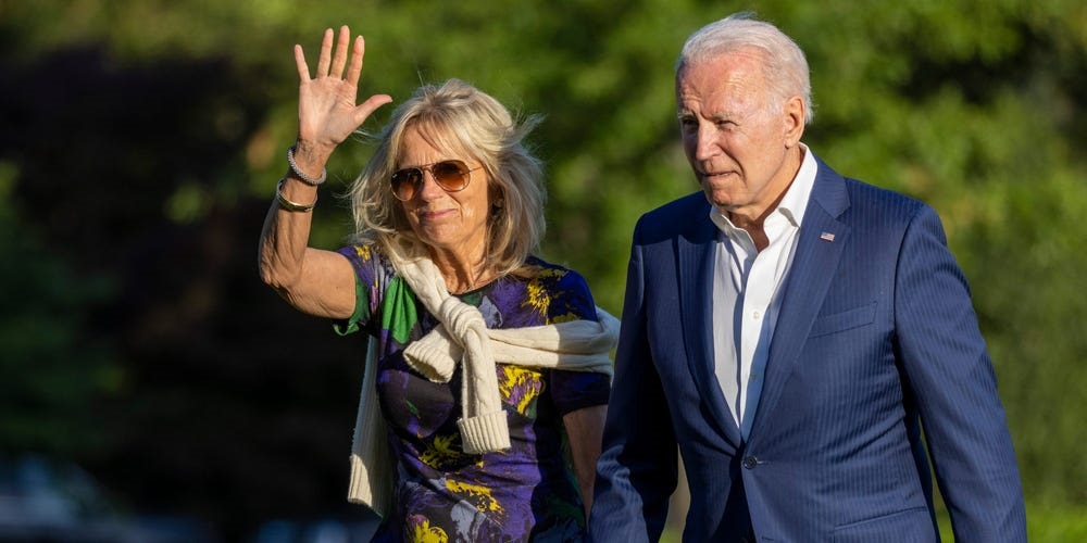 President Joe Biden and first lady Jill Biden walk