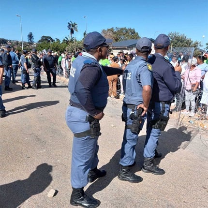 <p>Tension
is high as residents face off with police outside the Vredenburg Magistrate's
Court. </p><p><em>(Photo by Jenni Evans/News24)</em></p>