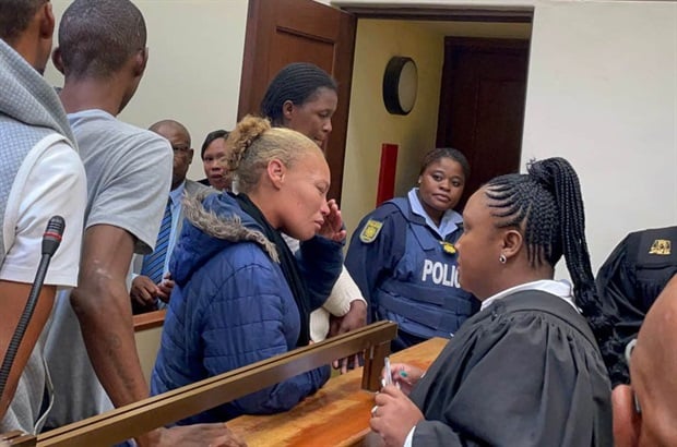 <p>The
accused in the Joshlin Smith case leave the Vredenburg Magistrate's Court.
</p><p><em>(Photo
Chelsea Ogilvie/News24)</em></p>