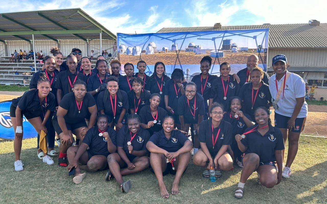 The Frances Baard female rugby team during the recent tournament in Calvinia. They were bronze medal receivers. With the team and assistant coaches is head coach, Claudia Francke (right). 
