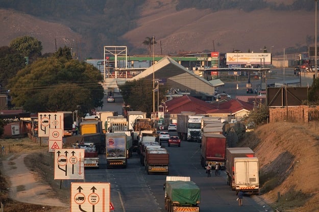 Trucks line up outside the Oshoek border-post on the South African side of the border with eSwatini as part of ongoing demonstrations. 
