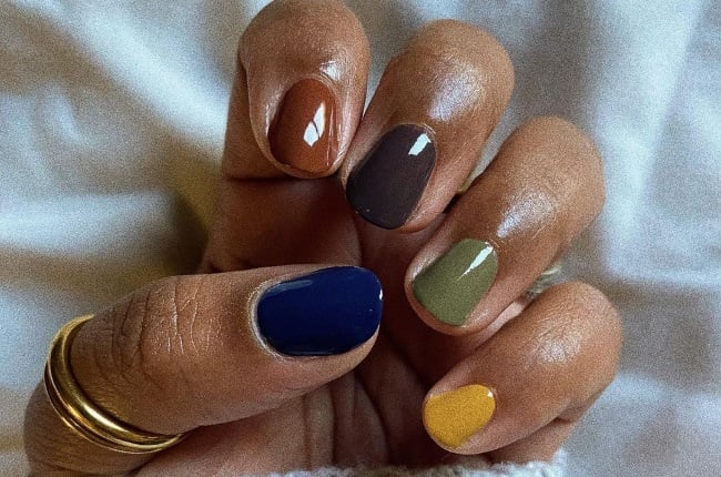 Multicoloured nails are all the rage, along with rainbow french tips, black and white, and swooping nails. (PHOTO: Instagram / @nailsbycanishiea)