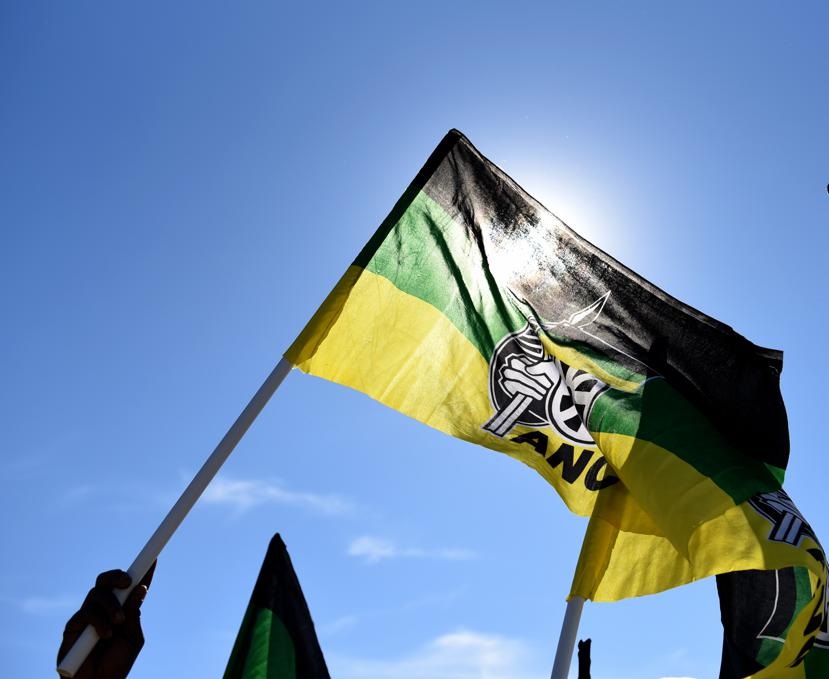 A large group of Zuma supporters were clad in ANC regalia, flying the party flag high outside the former president's home on Friday, July 2, 2021. Photo: Tebogo Letsie