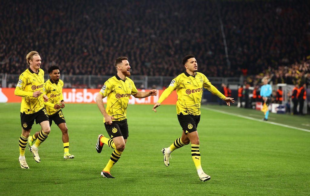 DORTMUND, GERMANY - MARCH 13: Jadon Sancho of Borussia Dortmund celebrates scoring his teams first goal during the UEFA Champions League 2023/24 round of 16 second leg match between Borussia Dortmund and PSV Eindhoven at Signal Iduna Park on March 13, 2024 in Dortmund, Germany. (Photo by Leon Kuegeler/Getty Images)