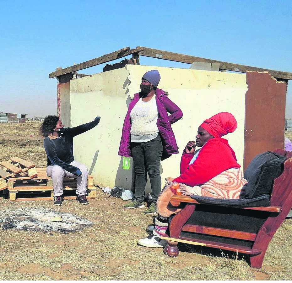 Hungry and destitute, the trio of Nompumelelo Msani, Anna Thakadi and Boniswa Msani said they endured the cold winter by sitting by the fire in the open while guarding their belongings from being stolen at the Klipfontein farm adjacent to the Caleb Motshabi settlement in Bloemfontein. Photos: Teboho Setena