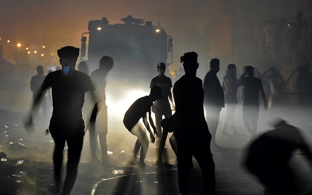 People gather near a fire truck as a group