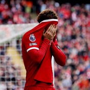 Liverpool's Title Hopes Dented After Shock Home Loss