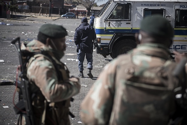 SANDF members patrol at streets and looted places in Soweto. 