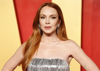 Lindsay Lohan talks postpartum body pressure and tells other moms to give themselves time 