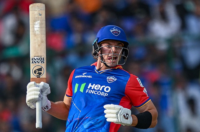 Delhi Capitals' Tristan Stubbs watches the ball after playing a shot during the Indian Premier League (IPL) match. (Money SHARMA / AFP)