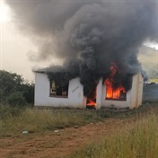 PICS: Residents burn zama zama houses  