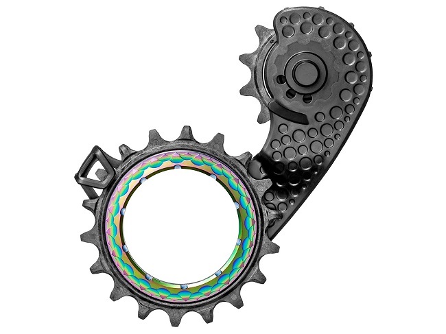 The hollow lower pulley wheel, is embedded to the derailleur cage’s structure, instead of centre-bolted. 