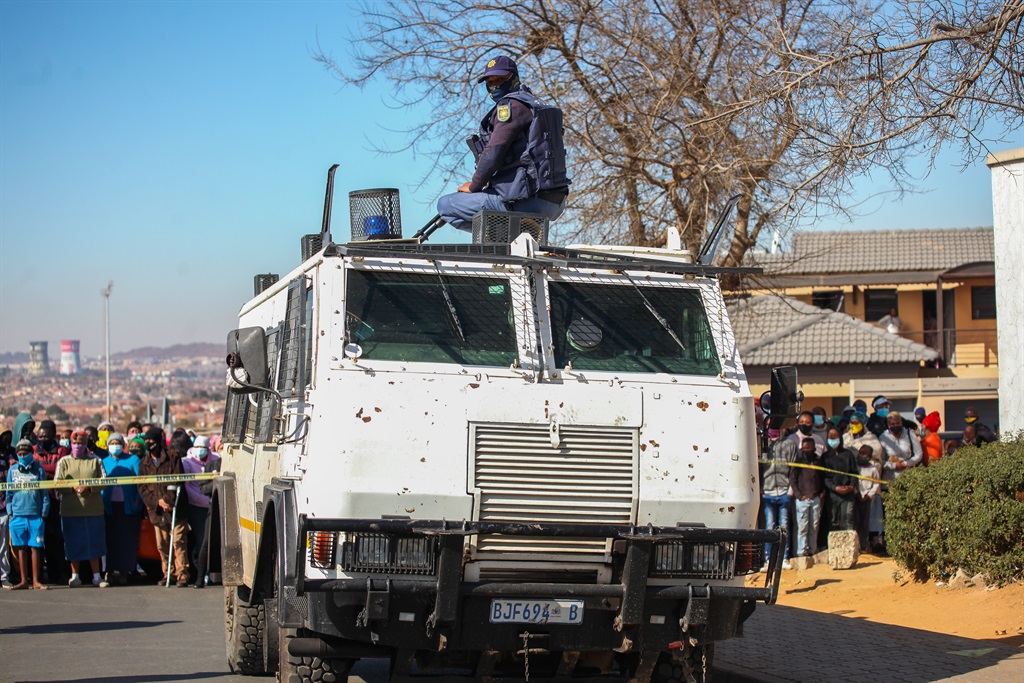 Cops patrol the streets of Soweto.