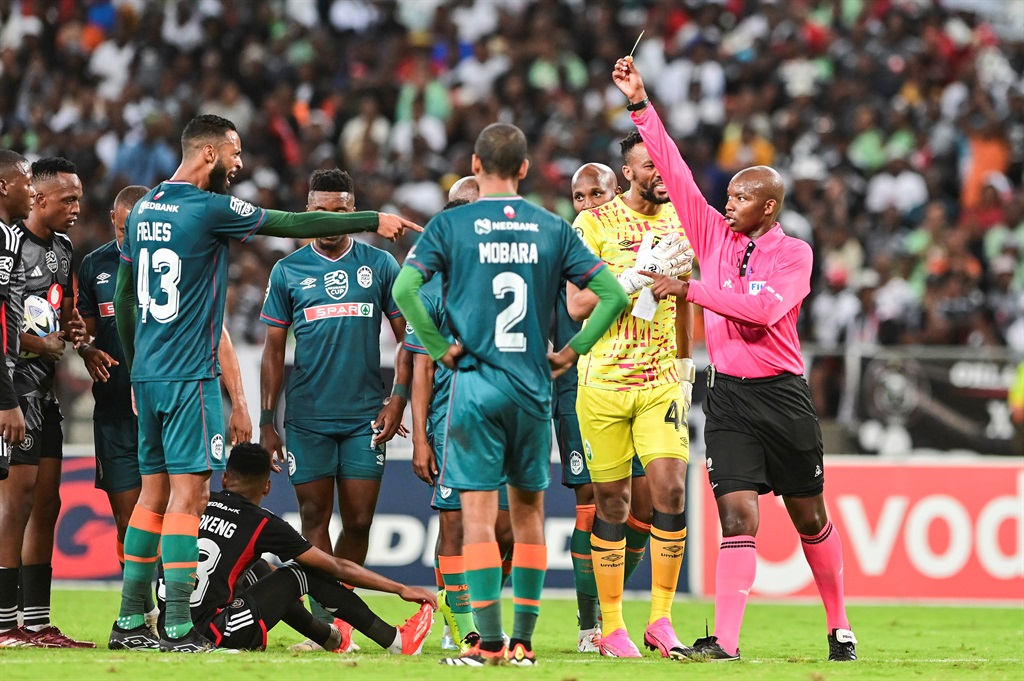 DURBAN, SOUTH AFRICA - APRIL 13: Referee Masixole Babiso gives Taariq Fielies of AmaZulu FC a yellow card during the Nedbank Cup, Quarter Final match between AmaZulu FC and Orlando Pirates at Moses Mabhida Stadium on April 13, 2024 in Durban, South Africa. (Photo by Darren Stewart/Gallo Images)