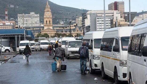 Taxis wait outside Cape Town Station Deck after an alleged shooting incident involving rival taxi drivers on 14 July. 