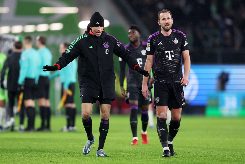 WOLFSBURG, GERMANY - DECEMBER 20: Thomas Mueller and Harry Kane of Bayern Munich interact following the teams victory during the Bundesliga match between VfL Wolfsburg and FC Bayern MÃ¼nchen at Volkswagen Arena on December 20, 2023 in Wolfsburg, Germany. (Photo by Joern Pollex/Getty Images)