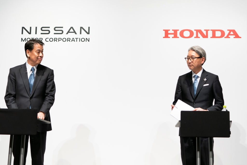 Nissan Motor CEO Makoto Uchida (L) and Honda Motor CEO Toshihiro Mibe (R) attend a joint press conference on 15 March, 2024 in Tokyo, Japan. The automakers announced their partnership on electric vehicles to compete with rival EV manufacturers such as Chinas BYD or US-based Tesla.  (Photo by Tomohiro Ohsumi/Getty Images)