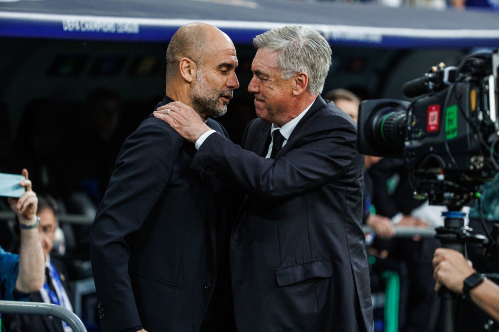 MADRID, SPAIN - MAY 9: Pep Guardiola, head coach of Manchester City with Carlo Ancelotti of Real Madrid during the UEFA Champions League semi-final first leg match between Real Madrid and Manchester City FC at Estadio Santiago Bernabeu on May 9, 2023 in Madrid, Spain. (Photo by MB Media/Getty Images)