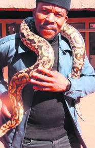 Mduduzi Mabaso with a python at Croc City’s Crocodile & Reptile Park.    Photo by Raymond Morare