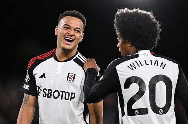 Rodrigo Muniz of Fulham celebrates scoring a goal with teammate Willian during the Premier League match at Craven Cottage (Photo by Mike Hewitt/Getty Images)