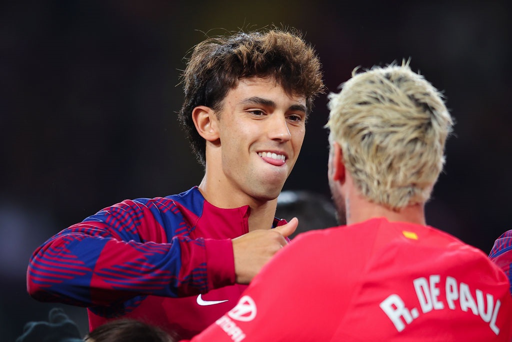 BARCELONA, SPAIN - DECEMBER 03: Joao Felix of FC Barcelona interacts with Rodrigo de Paul  of Atletico de Madrid prior to the LaLiga EA Sports match between FC Barcelona and Atletico Madrid at Estadi Olimpic Lluis Companys on December 03, 2023 in Barcelona, Spain. (Photo by Eric Alonso/Getty Images)