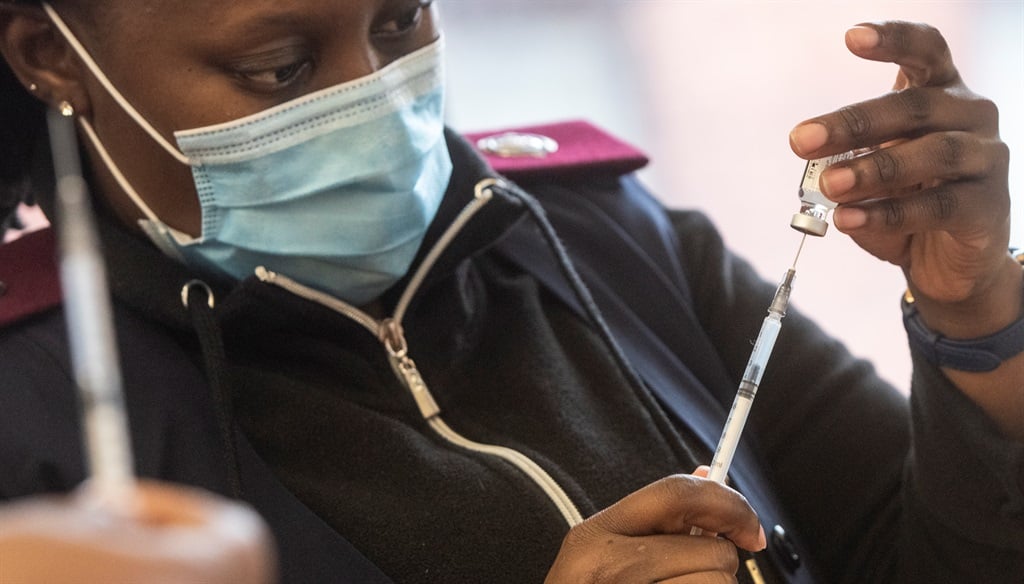 A health worker readies a Covid-19 vaccine jab. 