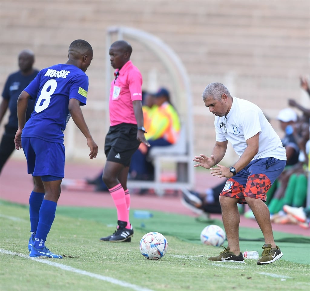 Magesi FC head coach Clinton Larsen engages his defender Lehlogonolo Mokone during one of the team's matches in the Motsepe Foundation Championship
