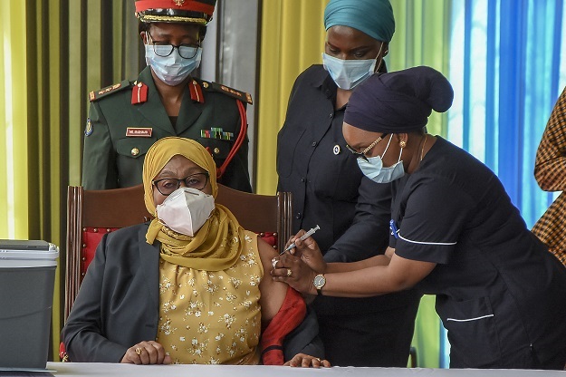Tanzania's President Samia Suluhu Hassan receives a shot of the Johnson & Johnson vaccine. 