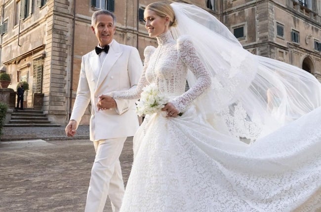 Michael and Kitty in their couture wedding outfits. Kitty's gown was made by Dolce & Gabbana (PHOTO: Magazine Features)