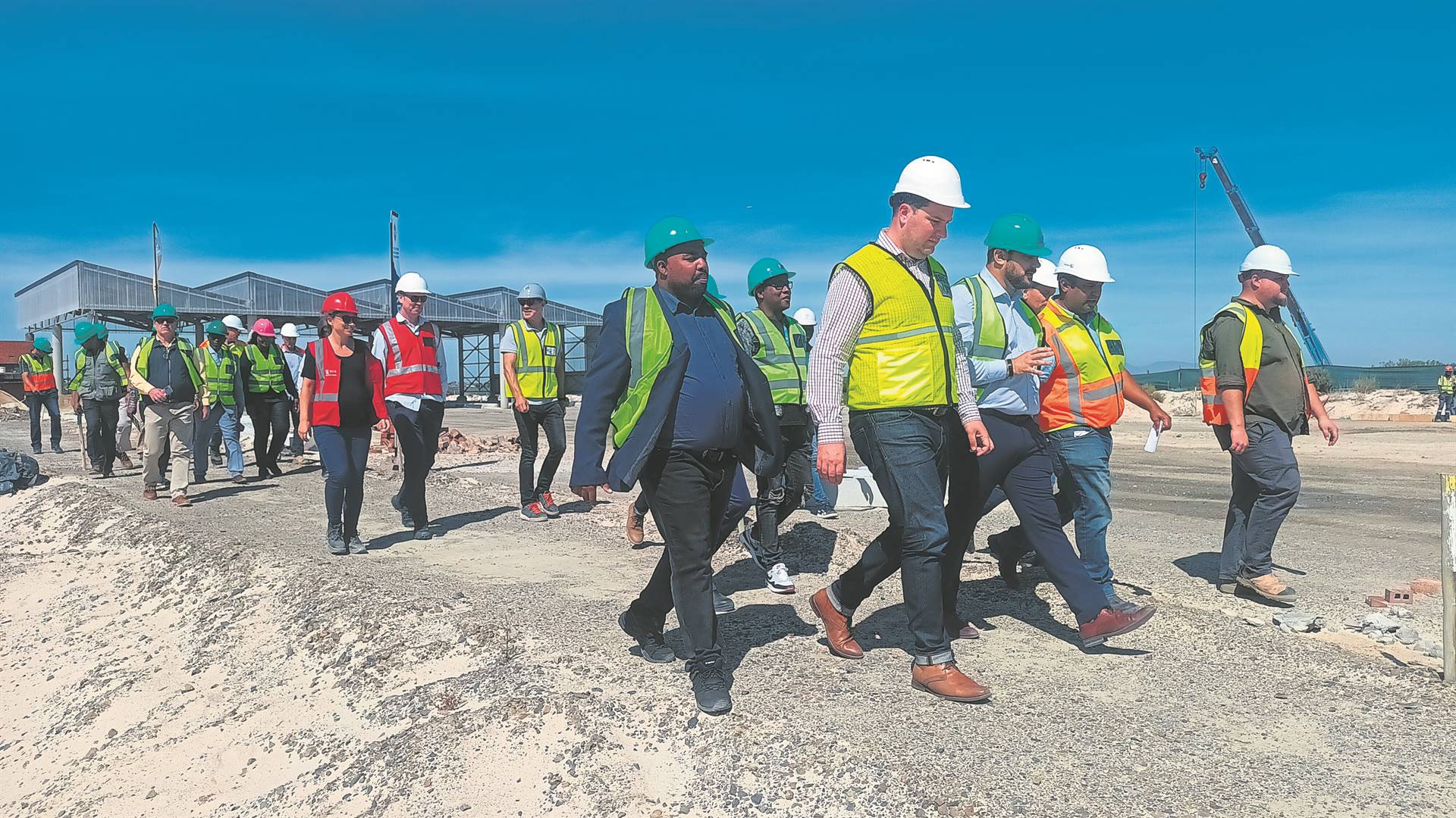 The City’s Mayor Geordin Hill-Lewis (white helmet) and Mayco member for urban mobility (green helmet) leading the crew during a MyCiTi site visit near Khayelitsha on Friday 15 March.PHOTOS: UNATHI OBOSE