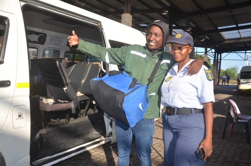 Excited Nkosinathi Mthimkhulu with Warrant Officer Abigail Nxumalo, who helped him to go back home in Orange Farm, Gauteng.  Photo by Oris Mnisi