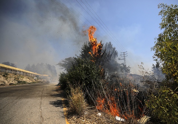 Fields burn in the northern town of Kiryat Shmona 