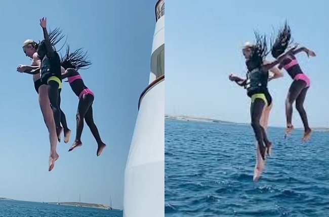 Charlize and her girls were seen leaping off a meg