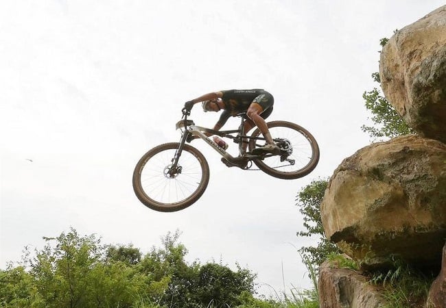 Alan flying off a drop, at the Tokyo mountain bike track (Photo: R24)